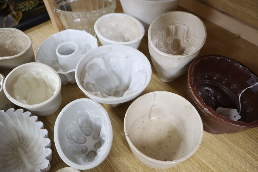 A collection of ceramic and toleware jelly moulds